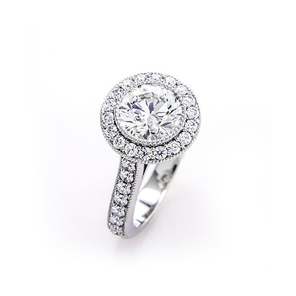 Round cut halo engagement ring in white gold