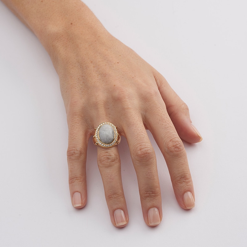 carved jadeite and diamond scarab ring on the ring finger