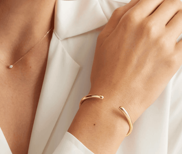 open contour bangle on the wrist