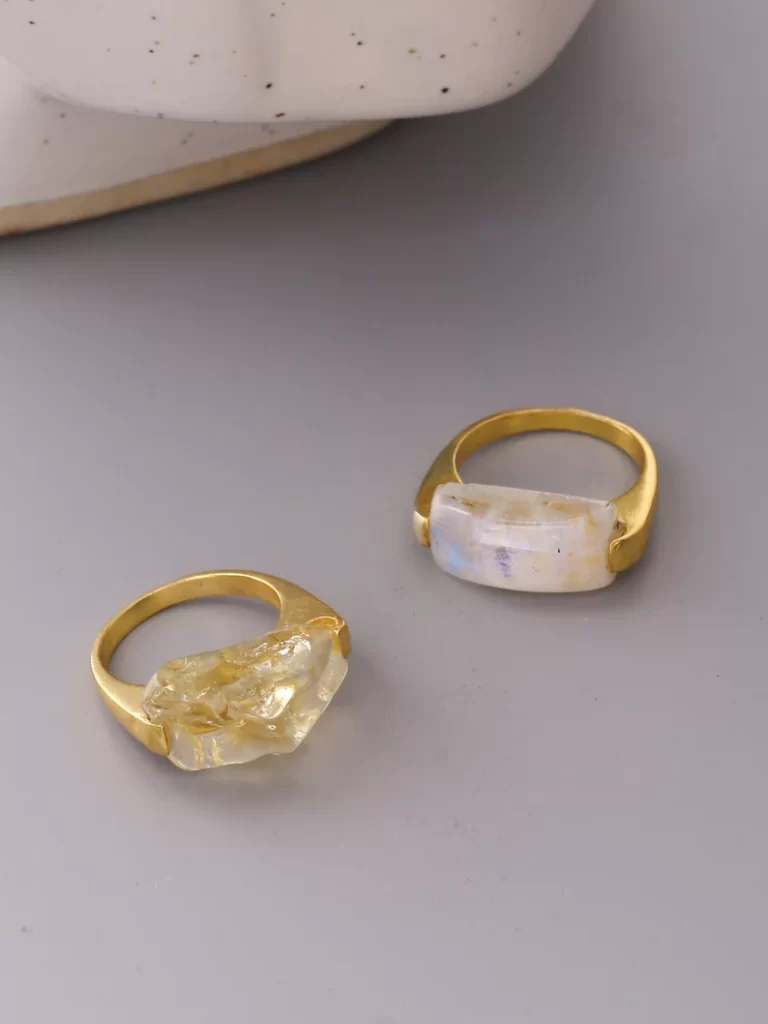 Raw gemstones in gold plated setting