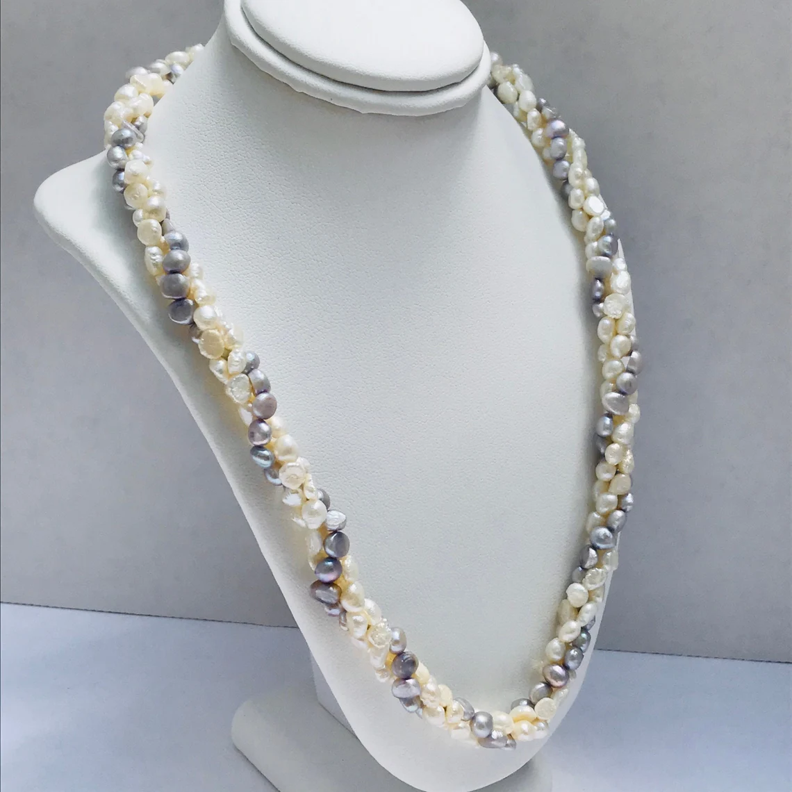 pearl bayadere necklace on a neck mannequin